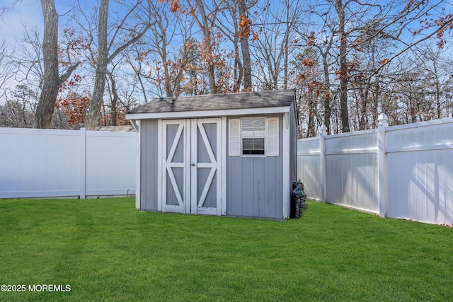 view of shed featuring a fenced backyard