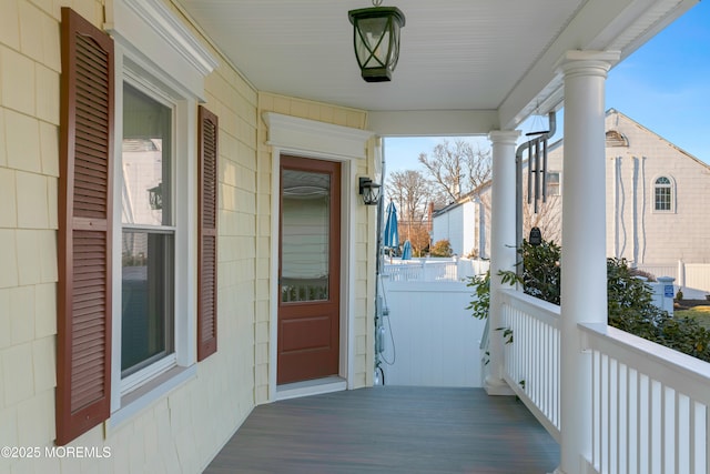 property entrance with covered porch