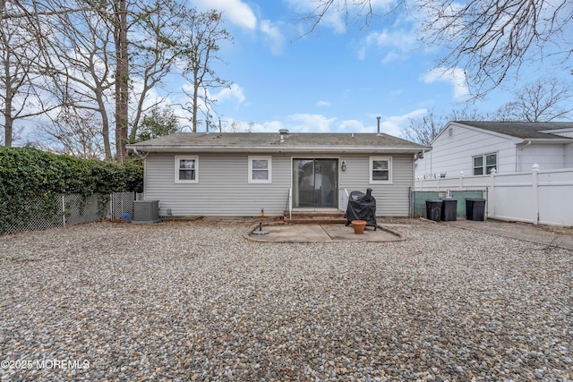 back of house with central AC, a patio area, and a fenced backyard