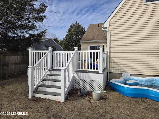 wooden deck featuring fence