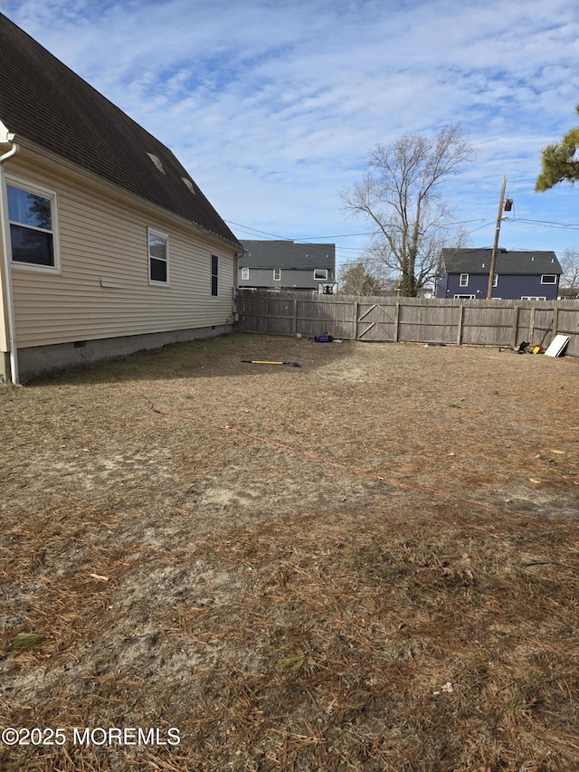 view of yard featuring a fenced backyard