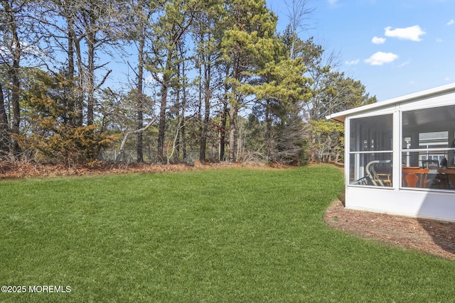 view of yard with a sunroom