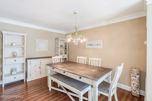 dining area with baseboards, dark wood-type flooring, ornamental molding, and a notable chandelier