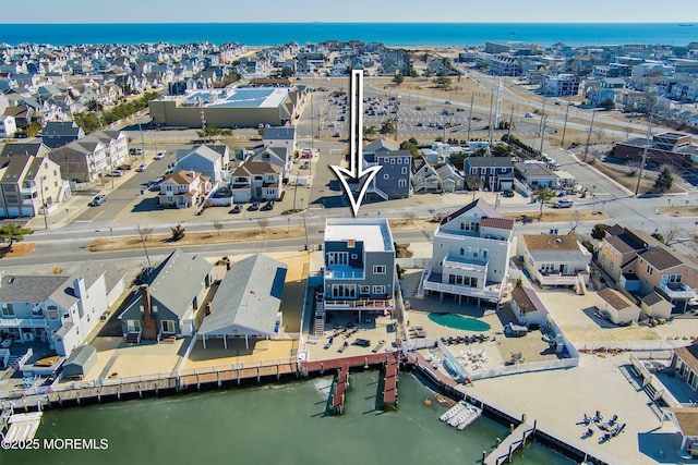 aerial view featuring a residential view and a water view