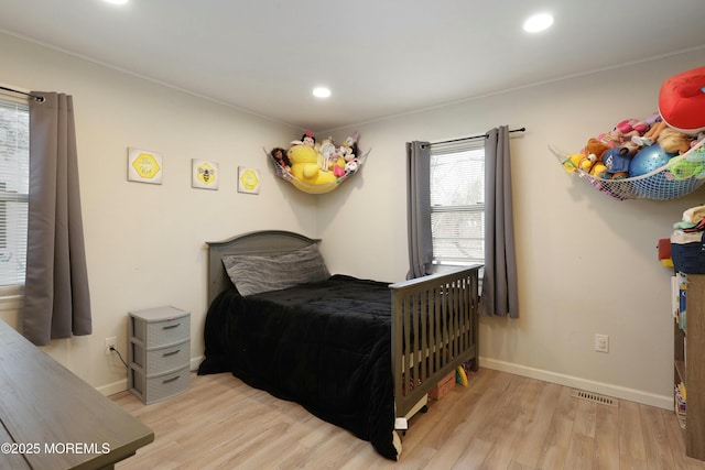 bedroom with recessed lighting, baseboards, and light wood finished floors