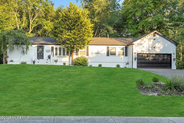 ranch-style house with an attached garage, a front lawn, and aphalt driveway