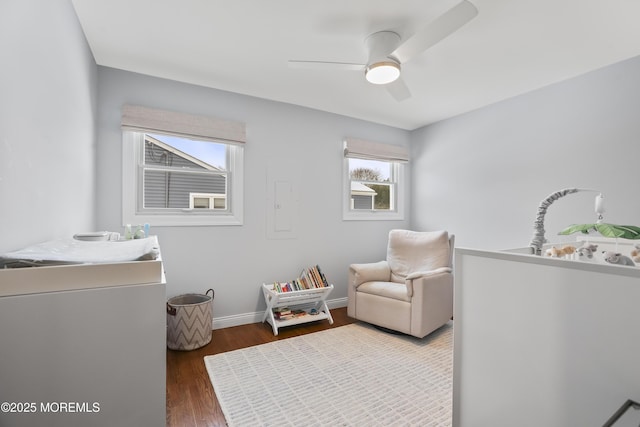 bedroom featuring ceiling fan, dark wood-type flooring, and baseboards