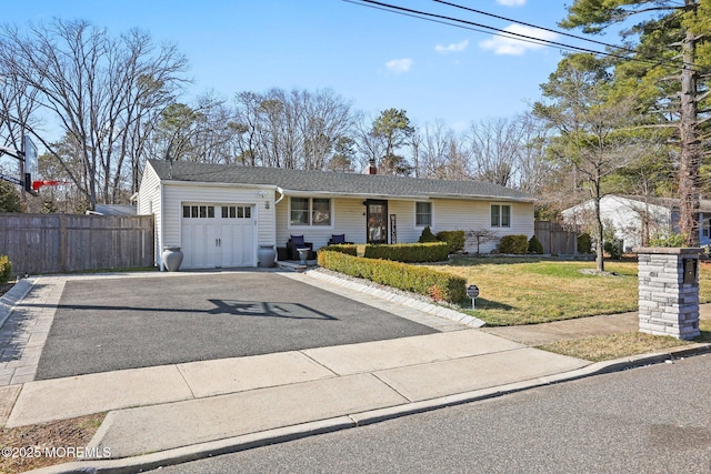 single story home featuring a front lawn, fence, a chimney, a garage, and driveway