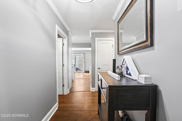 corridor with baseboards, dark wood-style floors, and crown molding