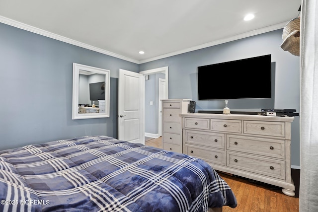 bedroom featuring recessed lighting, wood finished floors, and crown molding