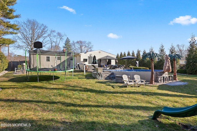 exterior space featuring a gazebo, an outdoor pool, and a trampoline