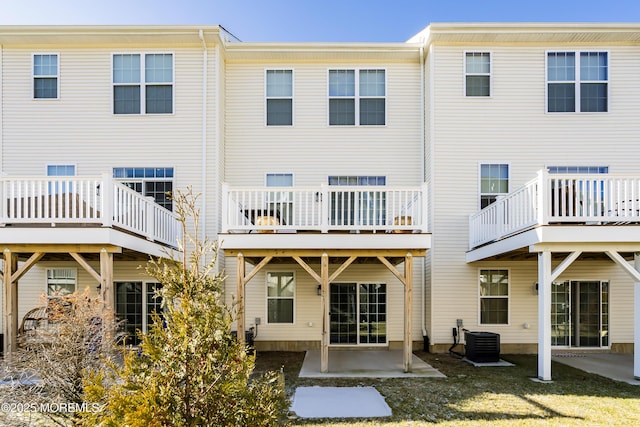 rear view of property featuring a patio and central AC unit