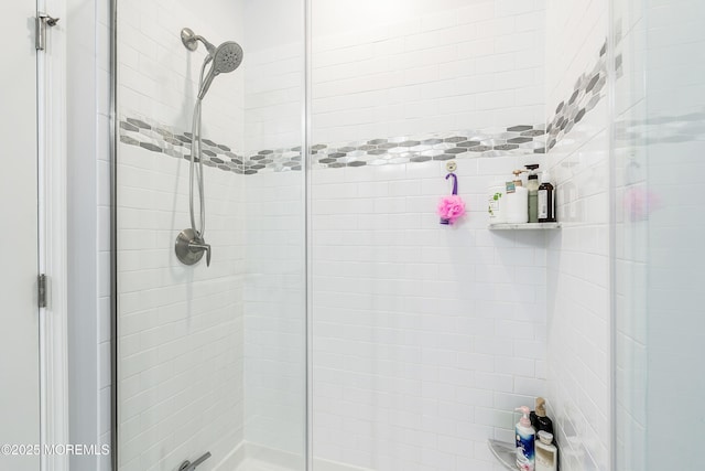 full bath with a shower stall