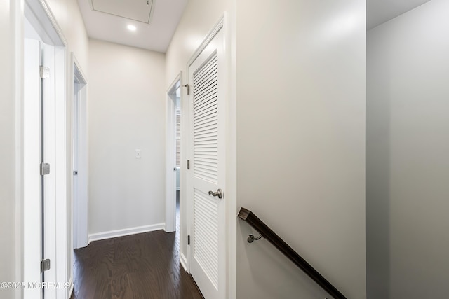 hallway featuring baseboards, dark wood-style flooring, and recessed lighting