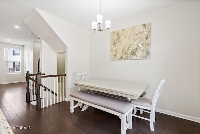 dining area with recessed lighting, dark wood-style flooring, baseboards, and an inviting chandelier