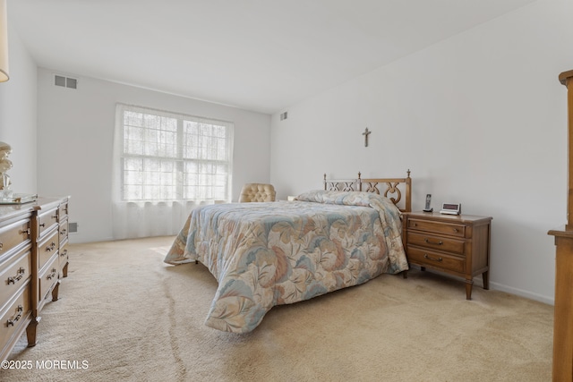 bedroom with light carpet and visible vents