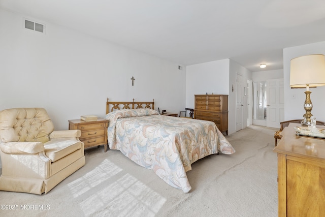 bedroom with light carpet and visible vents