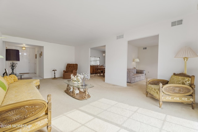 carpeted living room with visible vents