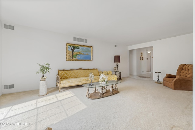 carpeted living room featuring visible vents