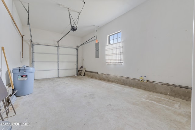 garage featuring a garage door opener and electric panel