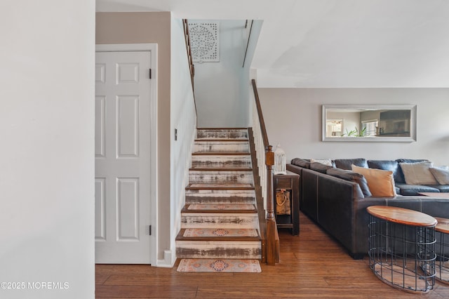 stairway featuring wood finished floors