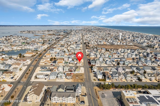 birds eye view of property featuring a water view and a residential view