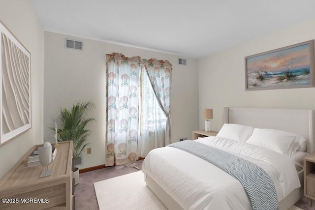 bedroom featuring carpet floors, visible vents, and baseboards