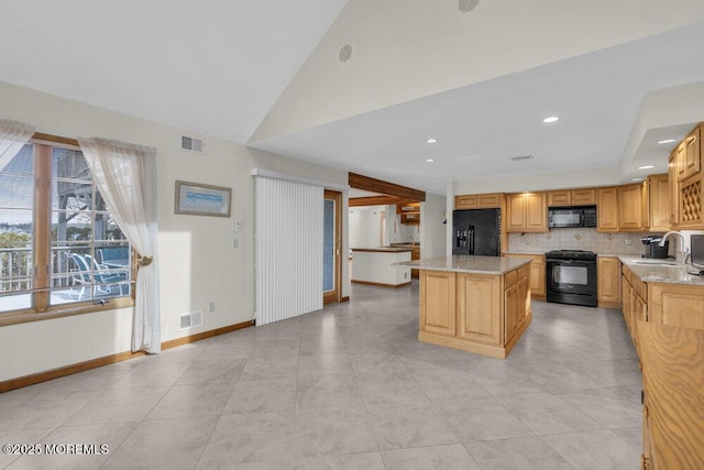 kitchen with black appliances, visible vents, backsplash, and a sink