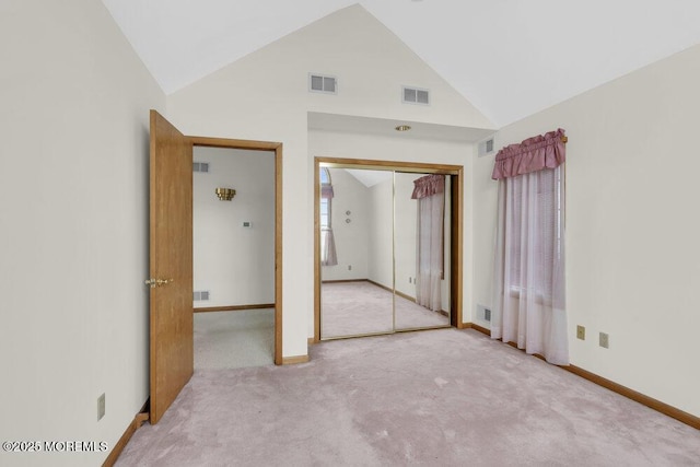 unfurnished bedroom featuring carpet, visible vents, and a closet