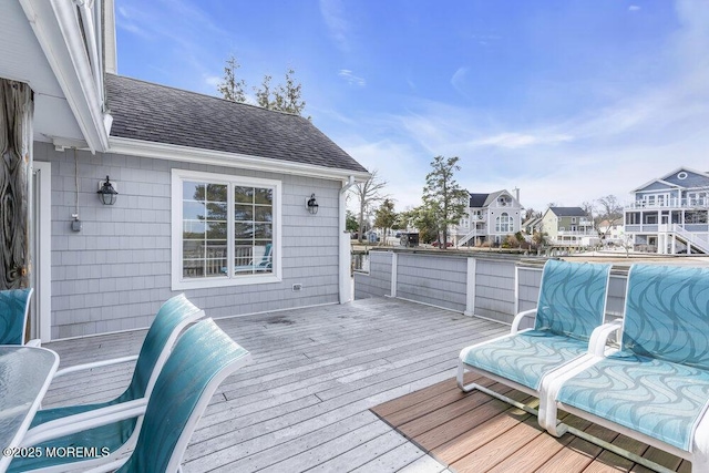 wooden terrace featuring a residential view