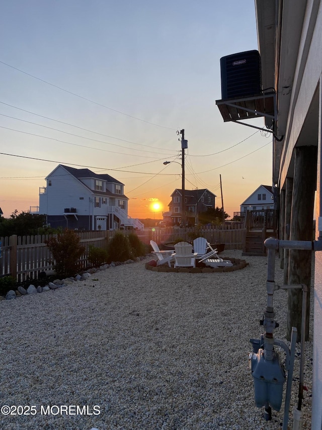 view of yard with fence and cooling unit