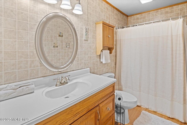 full bath featuring toilet, curtained shower, tile walls, and vanity