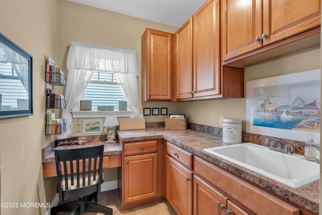 kitchen with brown cabinets and a sink