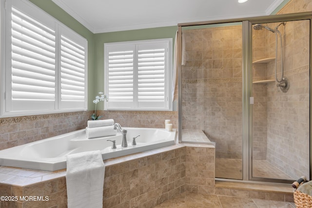 full bath featuring a garden tub, a shower stall, and ornamental molding