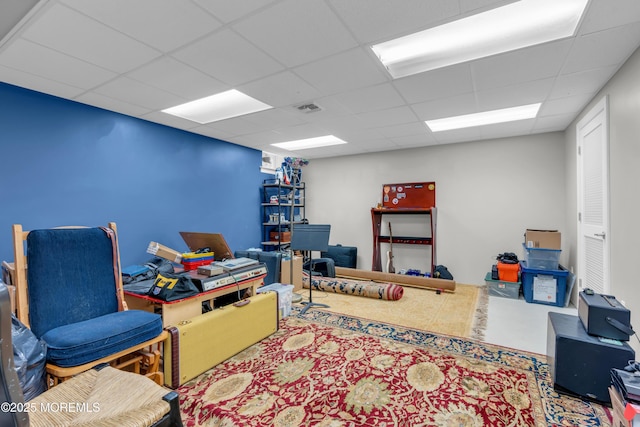 office area featuring a paneled ceiling and visible vents