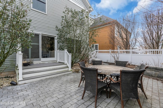 view of patio / terrace featuring outdoor dining space and fence