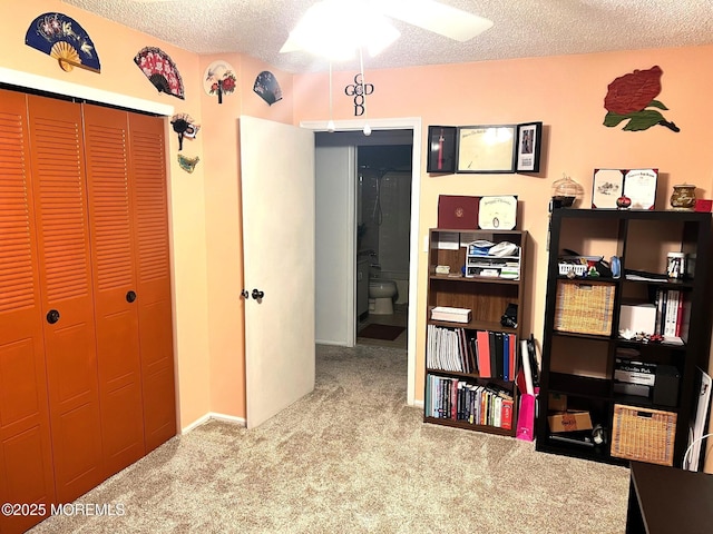 interior space featuring a textured ceiling and light carpet