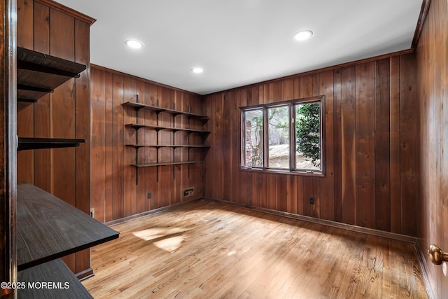 empty room with light wood-style floors, baseboards, and recessed lighting