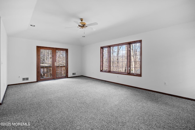 unfurnished room with carpet, plenty of natural light, baseboards, and a ceiling fan