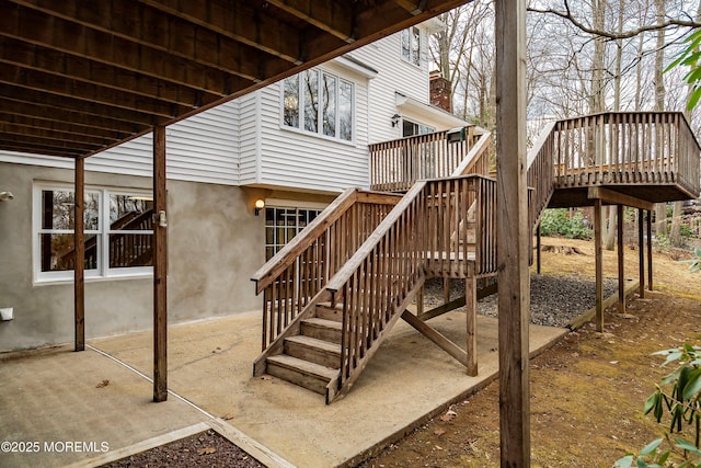 view of jungle gym with stairs and a deck