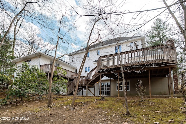 rear view of house with a deck and stairway