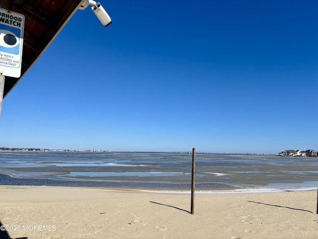 view of water feature with a beach view