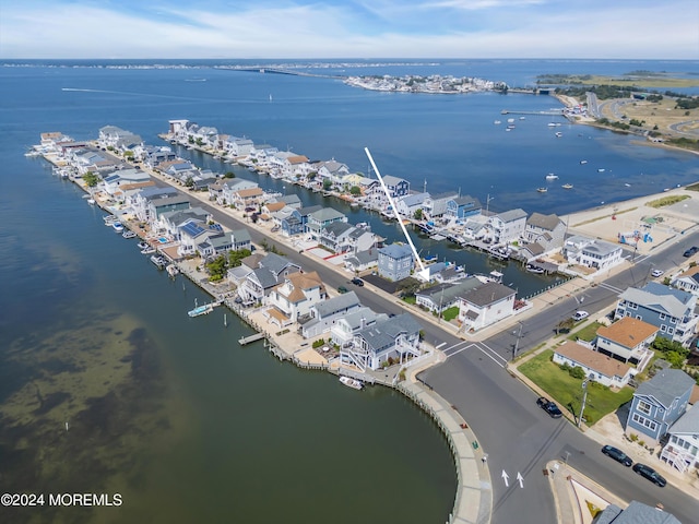 bird's eye view featuring a residential view and a water view