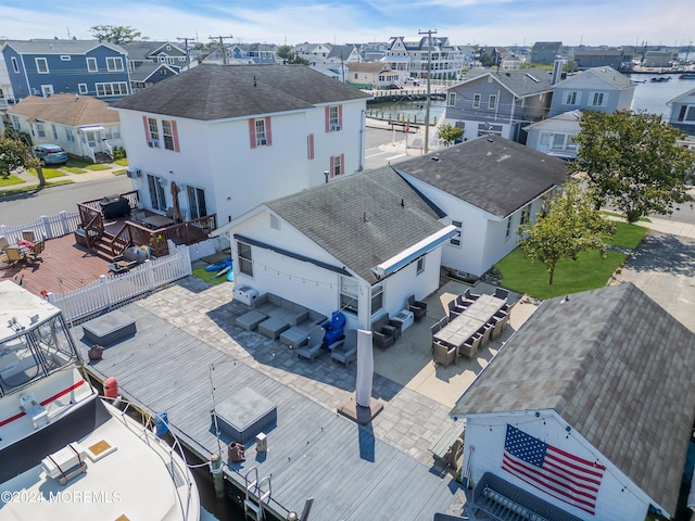 aerial view with a water view and a residential view