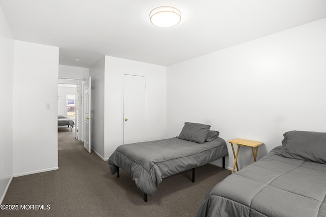 carpeted bedroom with baseboards