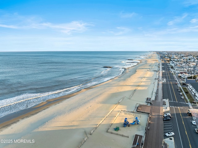 bird's eye view with a beach view and a water view