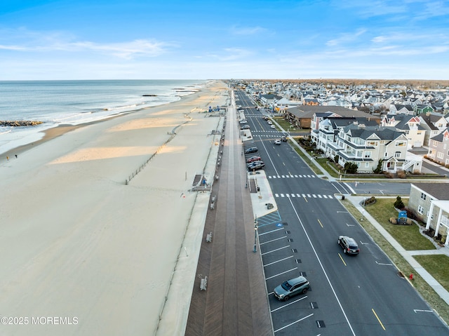 aerial view featuring a beach view and a water view