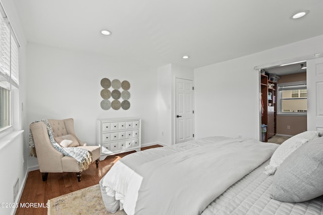 bedroom featuring visible vents, recessed lighting, baseboards, and wood finished floors