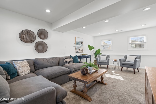 carpeted living area featuring visible vents, recessed lighting, and baseboards