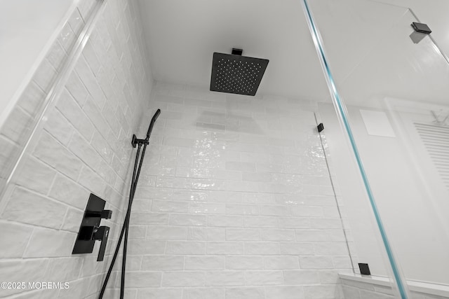 interior space with tiled shower